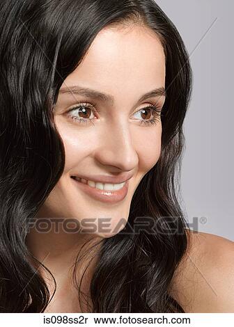 Stock Photography - Portrait of young brunette woman. Fotosearch