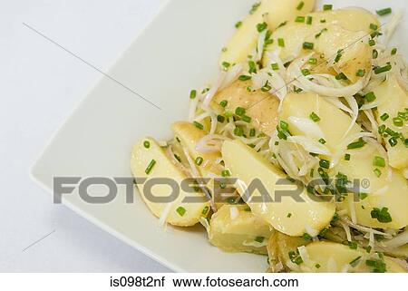 Potatoes with onions and chives View Large Photo Image Stock Image - Potatoes with onions and chives. Fotosearch