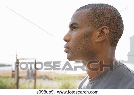 Profile of a man looking away View Large Photo Image Stock Image - Profile of a man looking away. Fotosearch