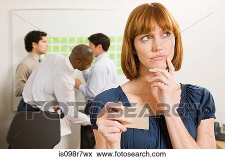 Quizzical looking office worker View Large Photo Image Stock Photo - Quizzical looking office worker. Fotosearch