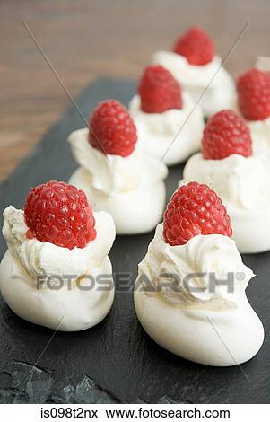 Stock Photo - Raspberry pavlova canapes. Fotosearch