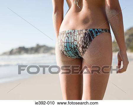 Rear view of a young woman View Large Photo Image Stock Image - Rear view of a young woman. Fotosearch