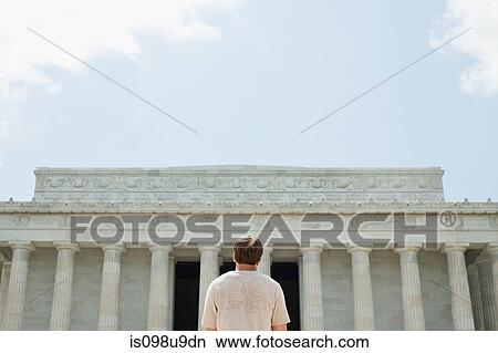 Picture - Rear view of young man at lincoln memorial. Fotosearch