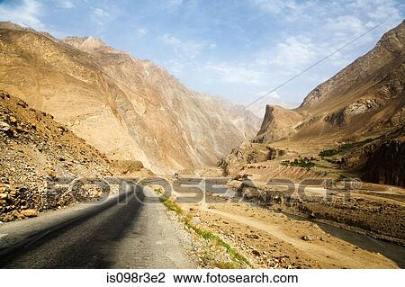 Road winding through gorge next to river View Large Photo Image Stock Image - Road winding through gorge next to river. Fotosearch