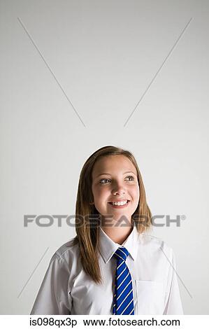 Stock Photography - School girl looking up. Fotosearch