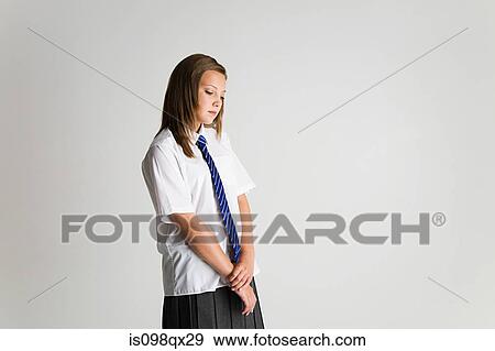 Schoolgirl looking sad View Large Photo Image Stock Photo - Schoolgirl looking sad. Fotosearch