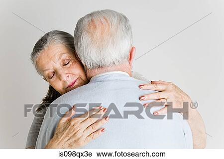 Stock Image - Senior couple hugging. Fotosearch