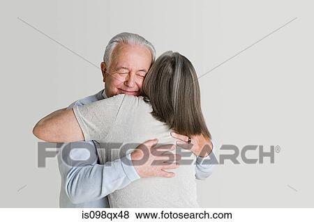 Senior couple hugging View Large Photo Image Stock Photo - Senior couple hugging. Fotosearch