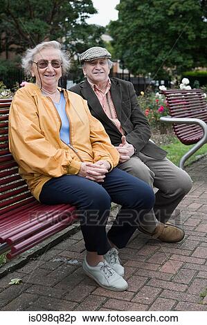 Stock Photography - Senior couple in park. Fotosearch