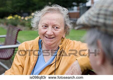 Stock Photography - Senior couple in park. Fotosearch
