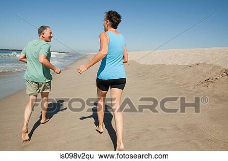 Senior couple with grandson on beach View Large Photo Image Stock Photograph - Senior couple with grandson on beach. Fotosearch