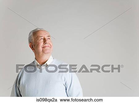 Stock Image - Senior man looking up. Fotosearch