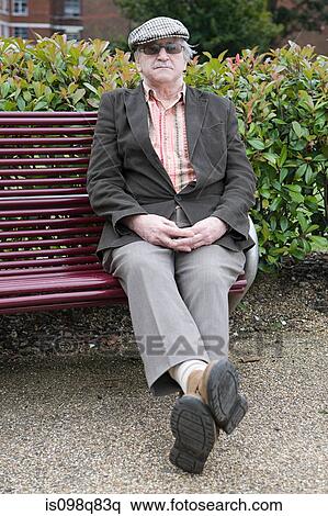 Stock Photography - Senior man on bench. Fotosearch
