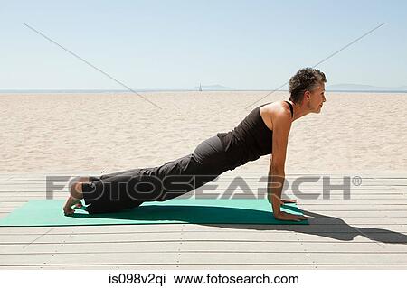 Senior woman doing yoga on beach View Large Photo Image Stock Image - Senior woman doing yoga on beach. Fotosearch