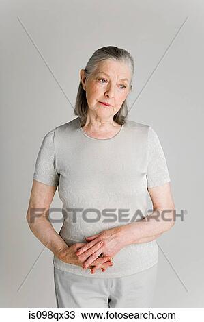 Stock Image - Senior woman looking worries. Fotosearch