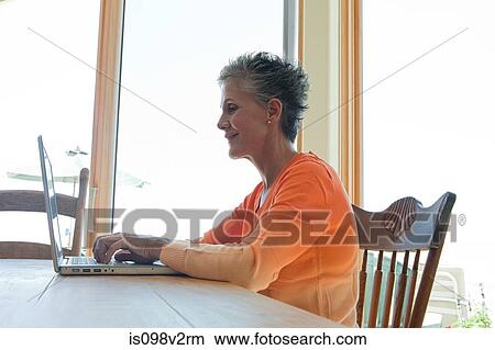 Senior woman using laptop View Large Photo Image Picture - Senior woman using laptop. Fotosearch
