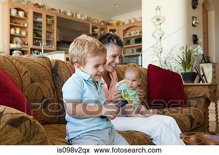 Senior woman with baby grandson and toddler View Large Photo Image Stock Photo - Senior woman with baby grandson and toddler. Fotosearch