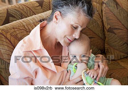 Stock Image - Senior woman with baby grandson. Fotosearch