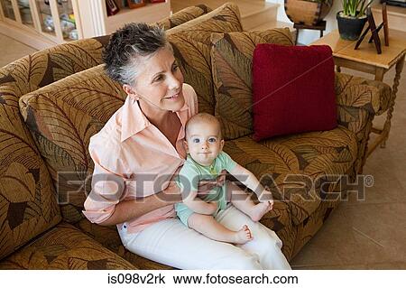 Stock Image - Senior woman with baby grandson. Fotosearch