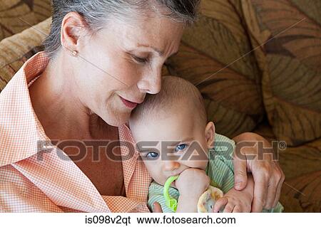 Senior woman with baby grandson View Large Photo Image Stock Photograph - Senior woman with baby grandson. Fotosearch