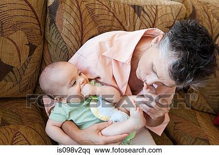 Senior woman with baby grandson View Large Photo Image Stock Photography - Senior woman with baby grandson. Fotosearch