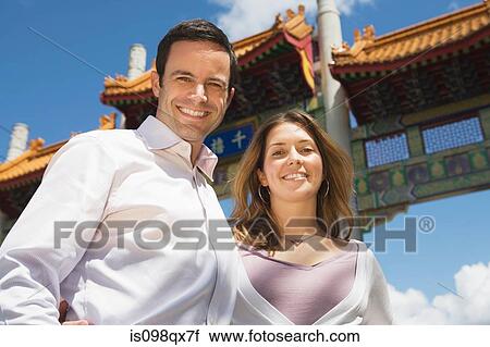 Stock Image - Sightseeing couple in vancouver chinatown. Fotosearch