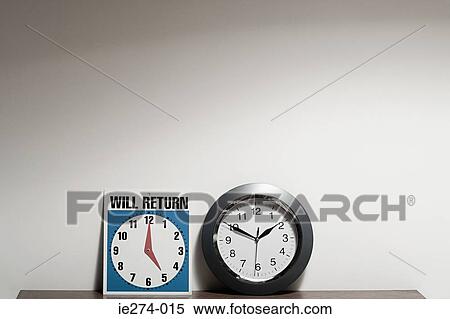 Stock Photography - Sign and clock. Fotosearch