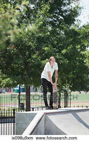 Skateboarder on ramp at skate park View Large Photo Image Picture - Skateboarder on ramp at skate park. Fotosearch