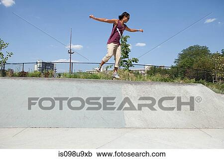 Skateboarder on ramp at skate park View Large Photo Image Stock Image - Skateboarder on ramp at skate park. Fotosearch