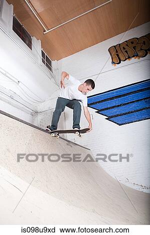 Skateboarder on ramp at skate park View Large Photo Image Stock Image - Skateboarder on ramp at skate park. Fotosearch