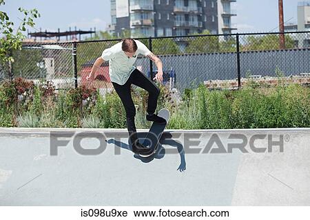 Skateboarder on ramp at skate park View Large Photo Image Stock Image - Skateboarder on ramp at skate park. Fotosearch