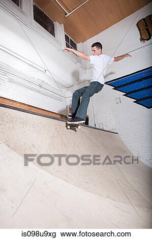 Skateboarder on ramp at skate park View Large Photo Image Stock Image - Skateboarder on ramp at skate park. Fotosearch