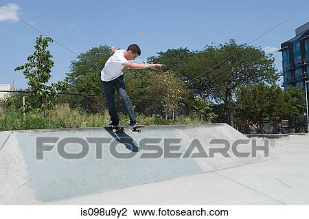Skateboarder on ramp at skate park View Large Photo Image Stock Image - Skateboarder on ramp at skate park. Fotosearch