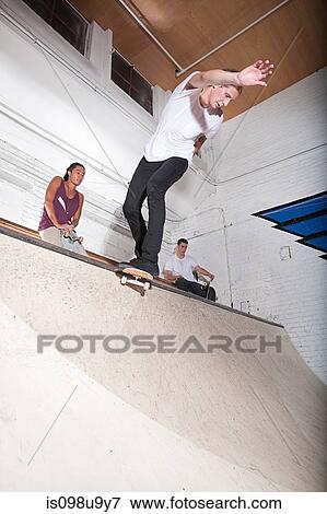 Skateboarder on ramp at skate park View Large Photo Image Stock Photo - Skateboarder on ramp at skate park. Fotosearch