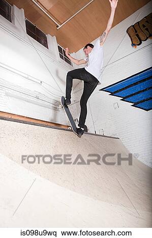 Skateboarder on ramp at skate park View Large Photo Image Stock Photography - Skateboarder on ramp at skate park. Fotosearch