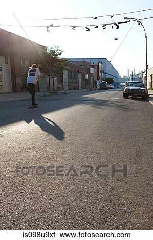 Skateboarder on urban street View Large Photo Image Stock Image - Skateboarder on urban street. Fotosearch