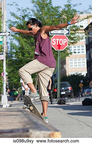 Skateboarder on urban street View Large Photo Image Stock Photo - Skateboarder on urban street. Fotosearch