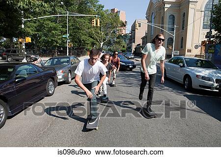Picture - Skateboarders on urban street. Fotosearch