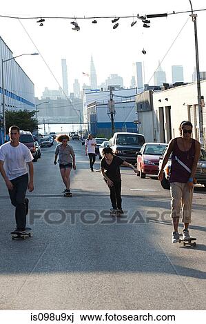 Skateboarders on urban street View Large Photo Image Stock Image - Skateboarders on urban street. Fotosearch