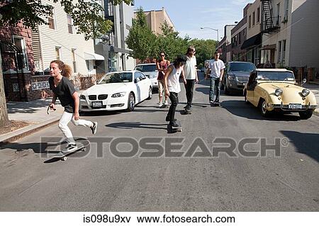 Skateboarders on urban street View Large Photo Image Stock Photo - Skateboarders on urban street. Fotosearch