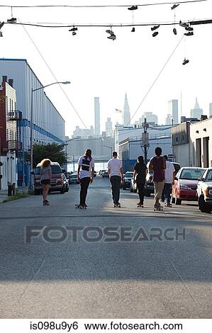 Skateboarders on urban street View Large Photo Image Stock Photograph - Skateboarders on urban street. Fotosearch