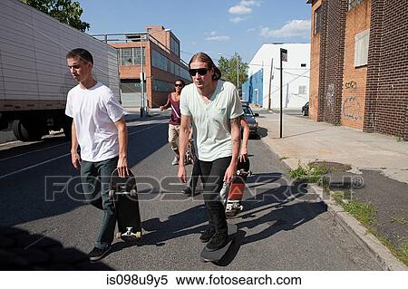 Stock Photography - Skateboarders on urban street. Fotosearch