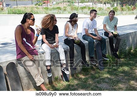 Skateboarders taking a break View Large Photo Image Stock Image - Skateboarders taking a break. Fotosearch