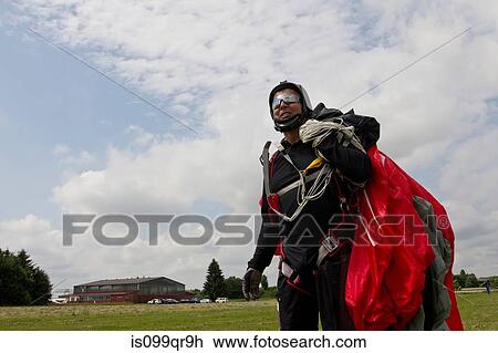 Skydiver with parachute View Large Photo Image Stock Image - Skydiver with parachute. Fotosearch