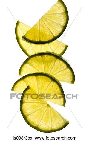 Slices of lime on white background View Large Photo Image Stock Photo - Slices of lime on white background. Fotosearch
