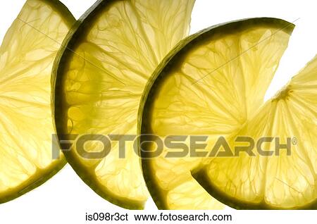 Stock Photograph - Slices of lime on white background. Fotosearch