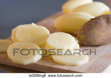 Slices of raw potato View Large Photo Image Stock Photograph - Slices of raw potato. Fotosearch