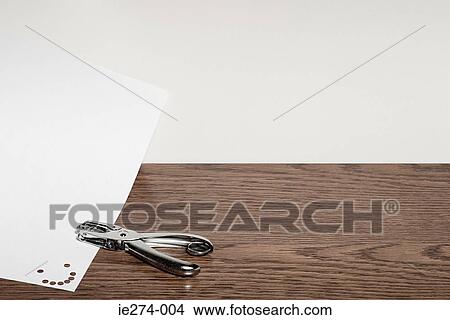 Smiley face and hole punch View Large Photo Image Picture - Smiley face and hole punch. Fotosearch