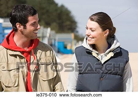 Smiling young couple View Large Photo Image Stock Image - Smiling young couple. Fotosearch