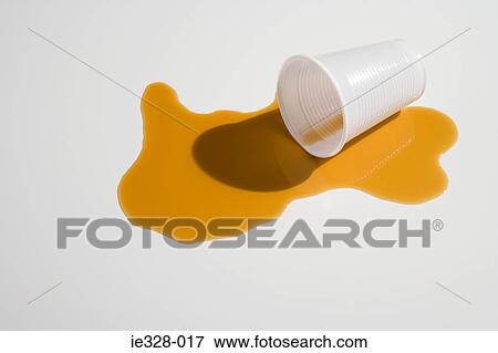 Spilt orange juice and a plastic cup View Large Photo Image Stock Photo - Spilt orange juice and a plastic cup. Fotosearch